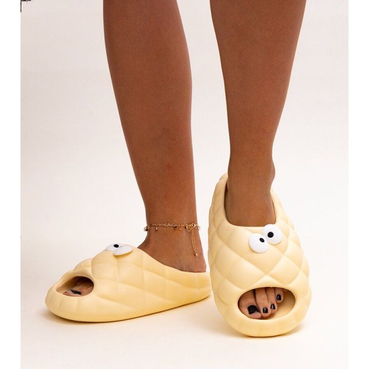 Smėlio spalvos Crocs“ tipo šlepetės su Gorgonės akimis