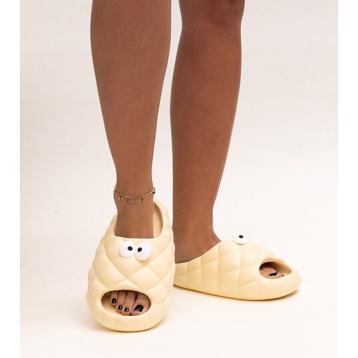Smėlio spalvos Crocs“ tipo šlepetės su Gorgonės akimis